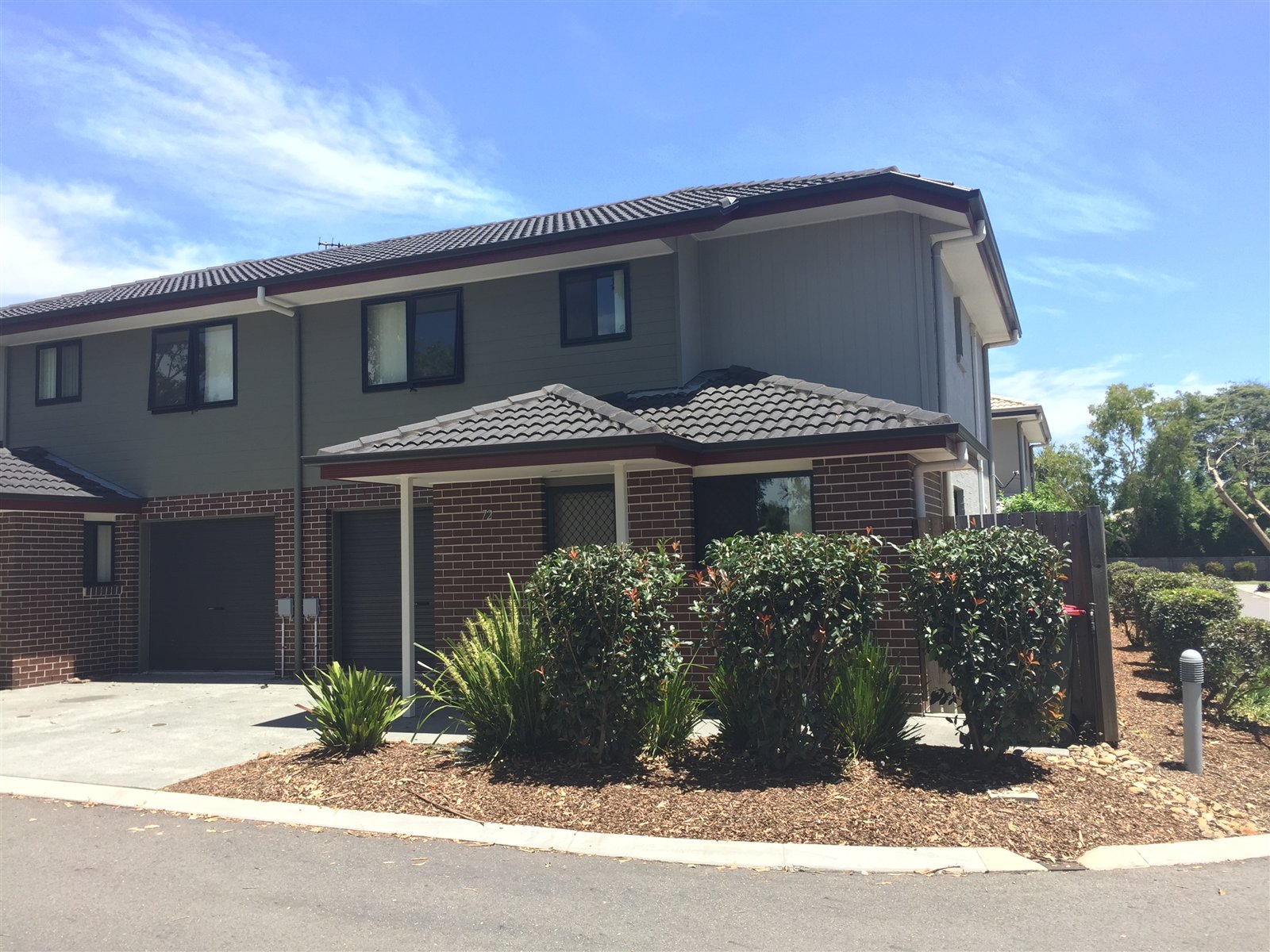 Corner townhouse and established garden planting at AcaciaFields
